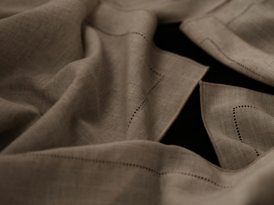 Natural linen fabric showing its woven texture.